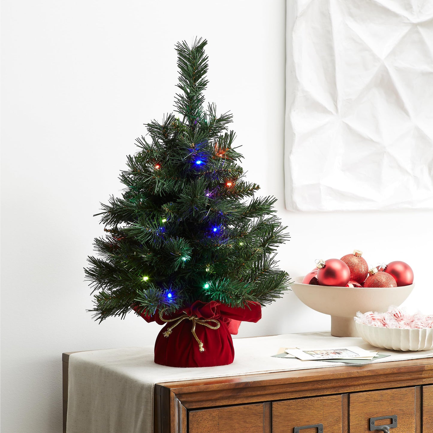 National Tree Company 24 in Pre-Lit Majestic Fir Artificial Christmas Tree, 35 Multicolor Lights, 71 Tips, Timer, Red Cloth Base, Green - Medaid International