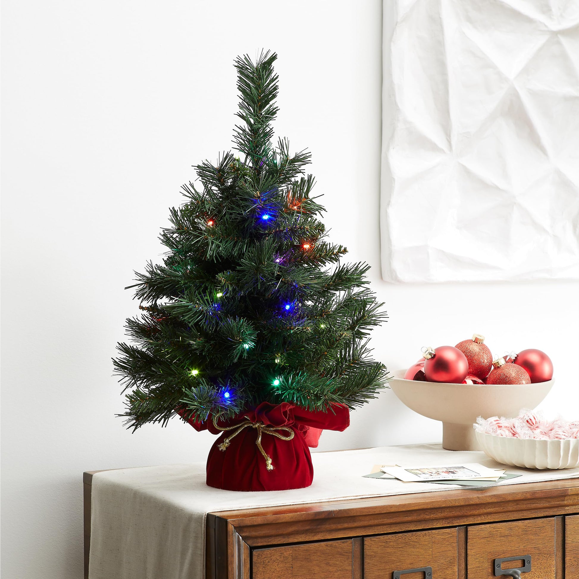 National Tree Company 24 in Pre-Lit Majestic Fir Artificial Christmas Tree, 35 Multicolor Lights, 71 Tips, Timer, Red Cloth Base, Green - Medaid International